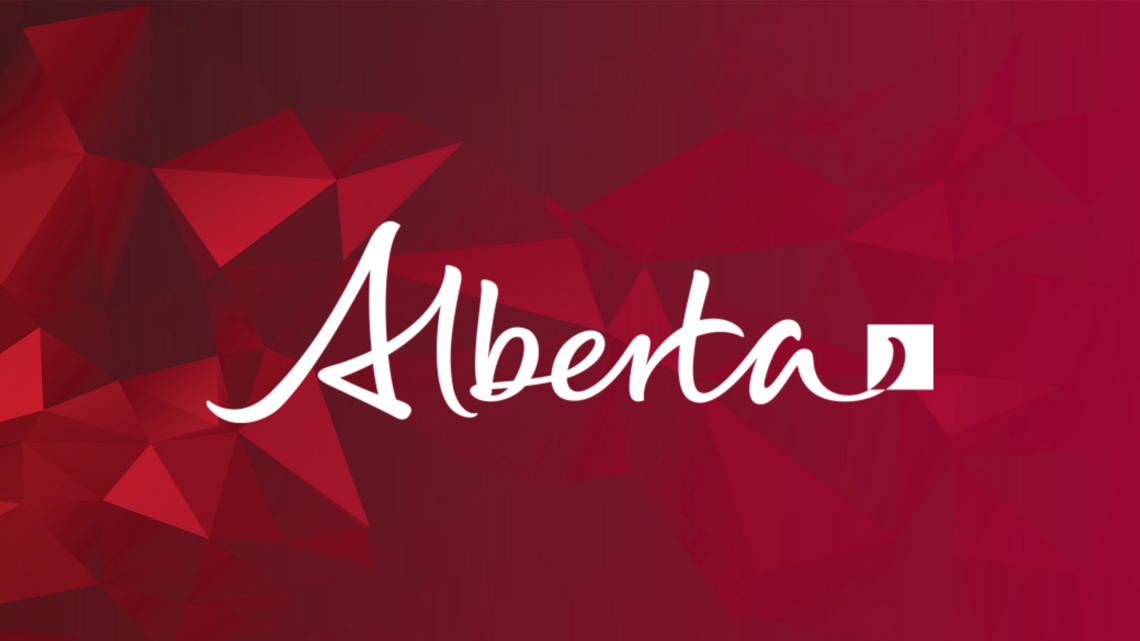 Alberta provincial logo on red geometric background